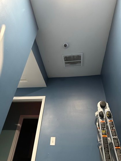 Interior camera covering the approach to the controlled door.