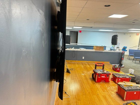 Edge-on: flush mounting depth with power and signal dressed in behind the panels.